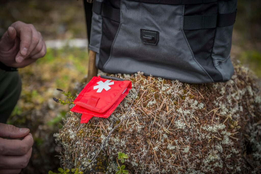 A very small minimalist first aid pouch.
