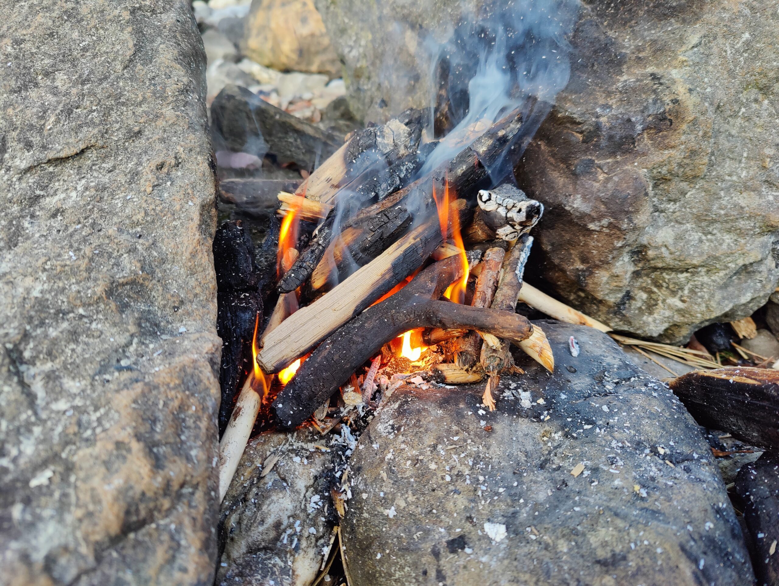 A small fire between two rocks